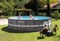 Каркасный бассейн Ultra XTR Frame Pool Intex 26334 + песочный фильтр насос 7900 л/ч, лестница, тент, подстилка (610х122) - фото 169701